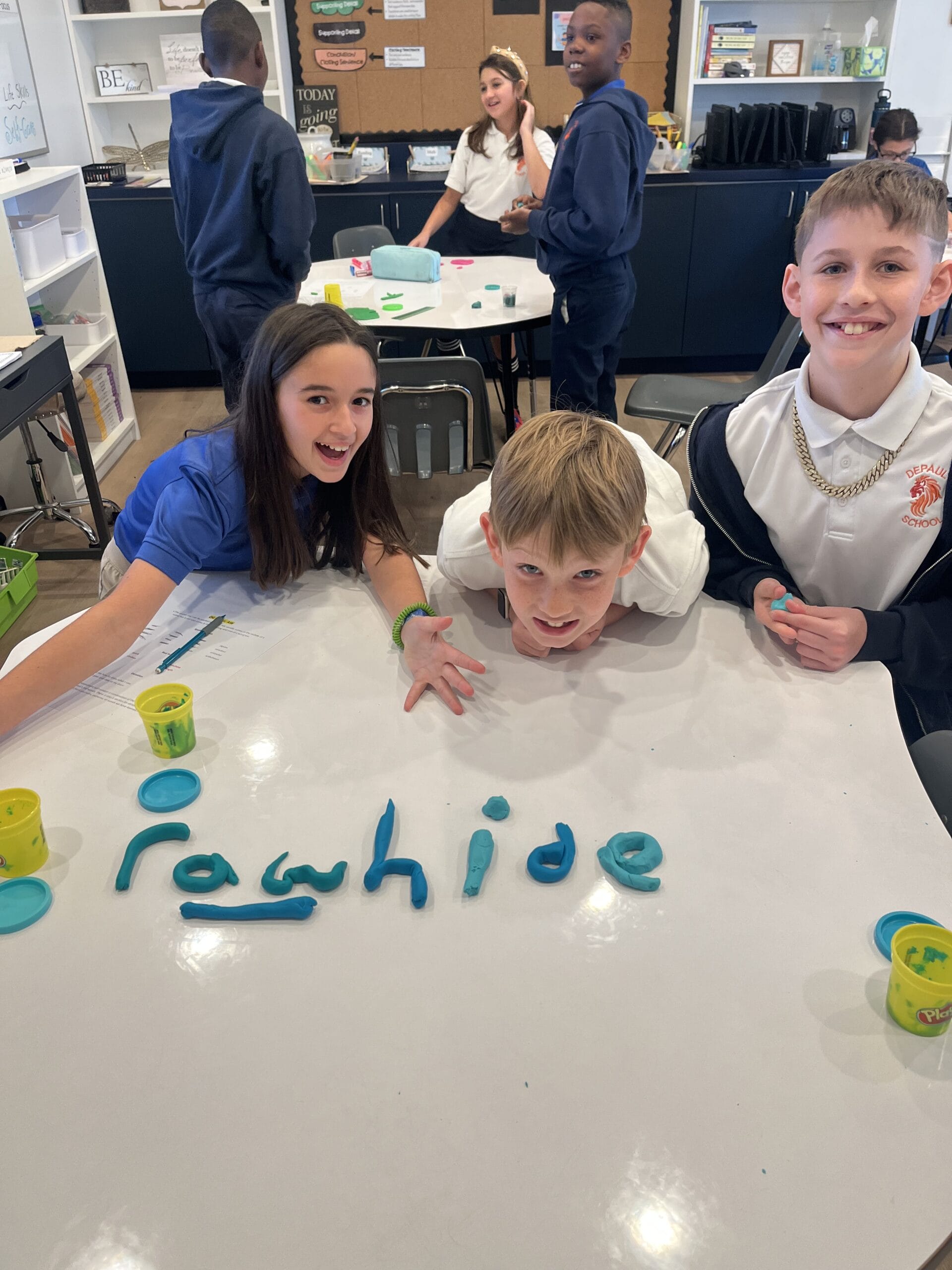 A vibrant classroom scene with students engaged in learning activities, showcasing collaboration and creativity.