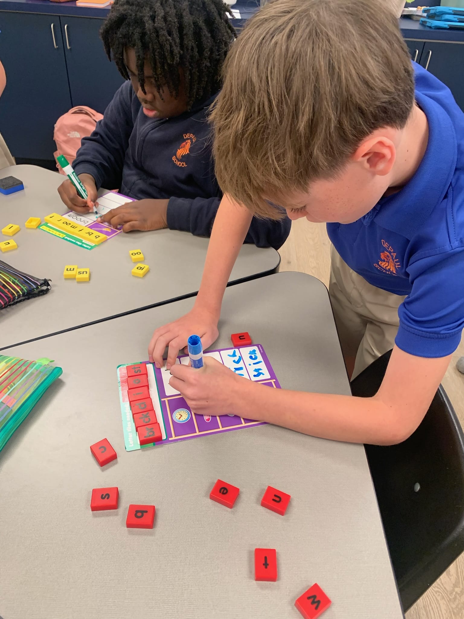 A vibrant classroom setting at DePaul School, showcasing students engaged in collaborative learning activities.